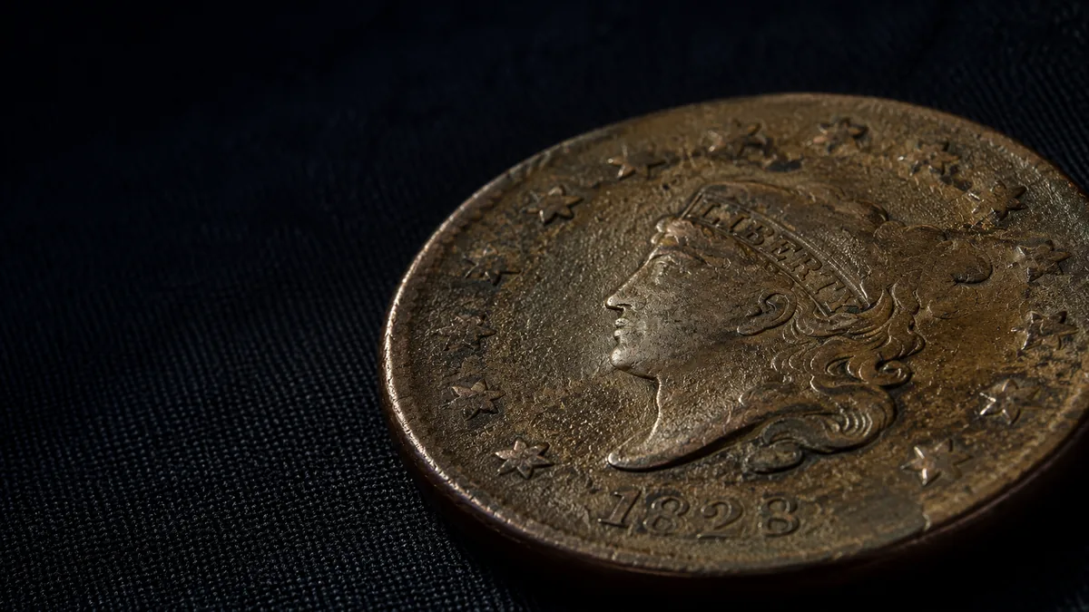Early American copper cent showing circulated wear